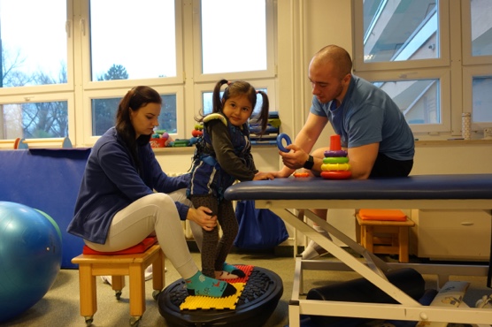 Girl with Leigh syndrome participating in therapy